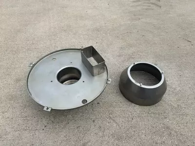 Refurbished burner cowl components from Nilfisk Contractor diesel hot pressure washer after cleaning.